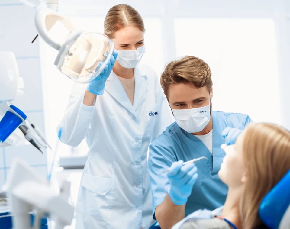dental treatment - dentists working on patient